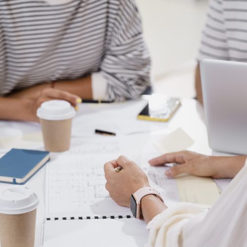 close-up-young-colleagues-having-meeting